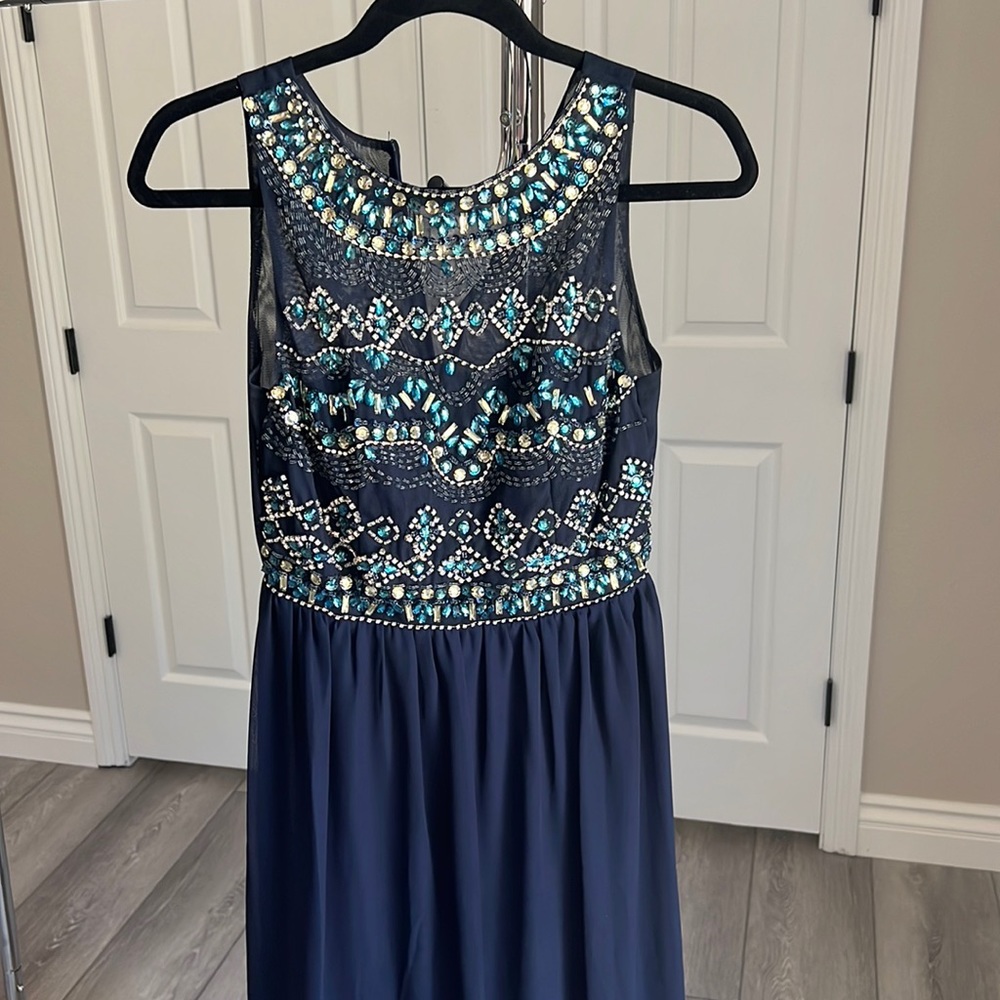Beautiful beaded top on this navy blue long dress